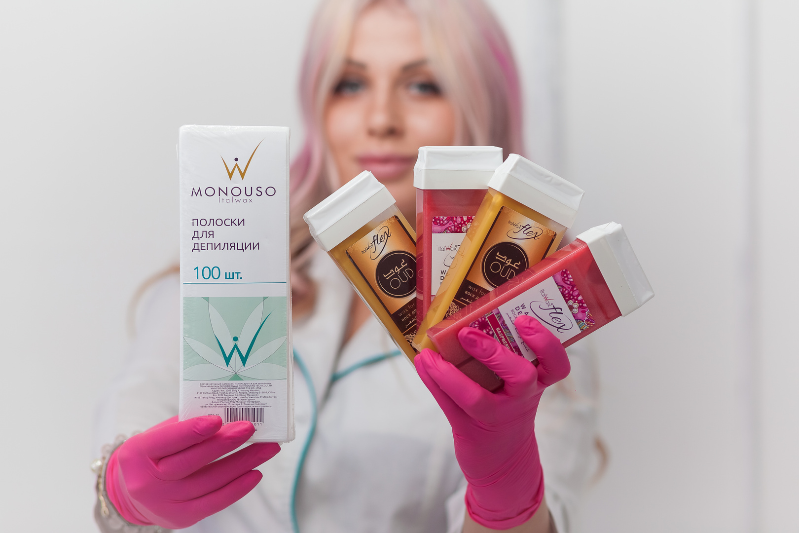 Woman cosmetologist demonstrating products for depilation